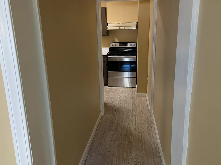 Hallway into kitchen. New range