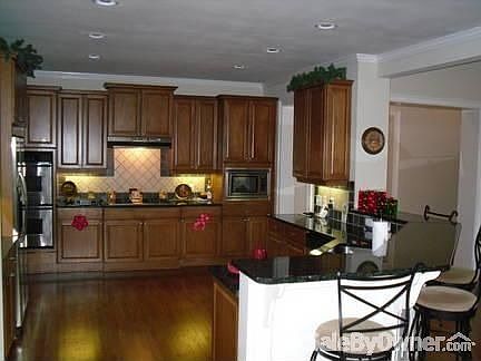 Custom Kitchen
						:
						Large area for parties and family gatherings. Bar seats at least five.