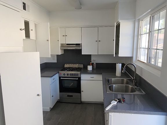 Kitchen, quartz countertops and gas stove.