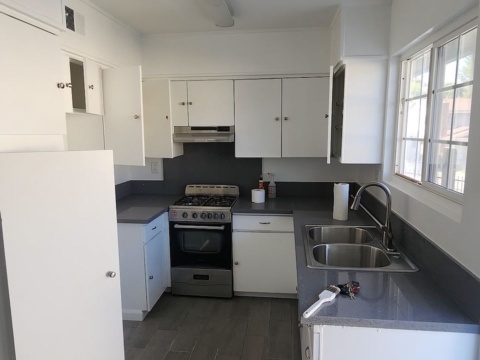 Kitchen, quartz countertops and gas stove.