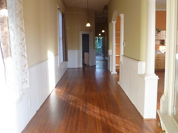 9' wide hallway, big enough to serve as a passthrough library, office, or play area! Straight shot to the back door allows cool breeze to pass though the house on Spring days!