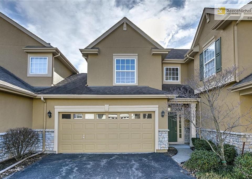 Stucco and stone front elevation - 2 car garage is a bonus!
