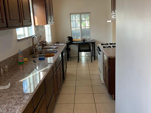 Newly remodeled kitchen, granite counter tops, EXTRA large cabinets top and bottom, gas stove with dishwasher, stainless steel modern deep sink with large over hang faucet. Cook your next Thankgiving Dinner here.