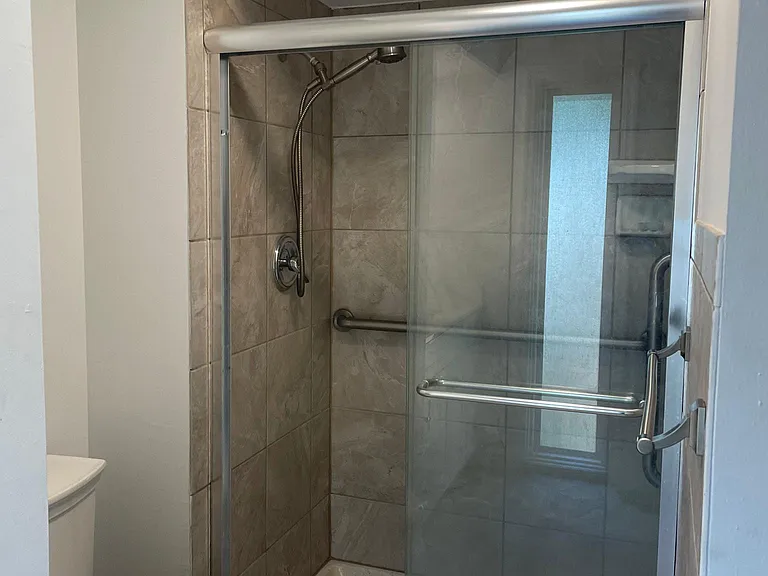 Primary bedroom shower. Tiled