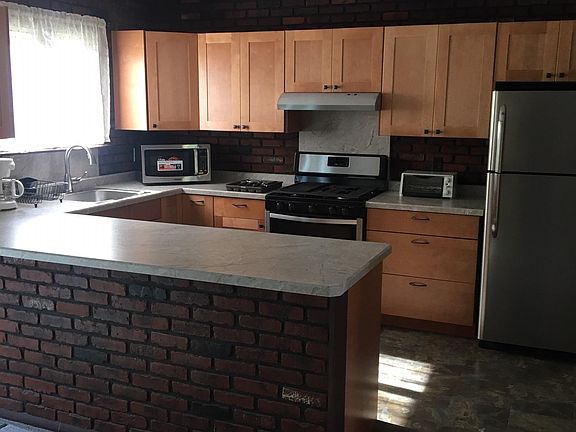 New cabinets, flooring, counter-top and appliances