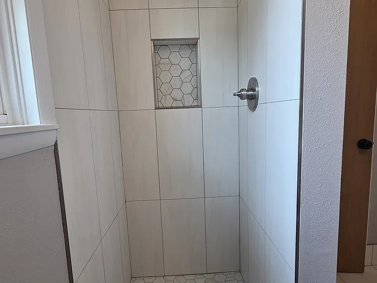 New shower tile and fixtures