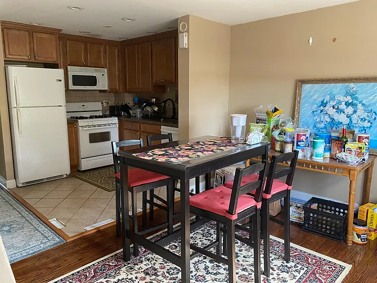 View of dining area and kitchen.