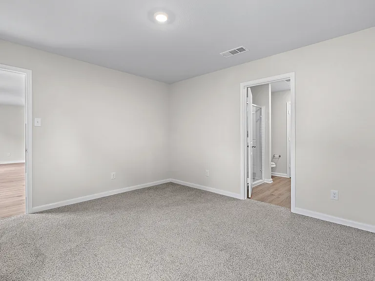 The master suite has a large bedroom, ensuite bathroom and walk-in closet.