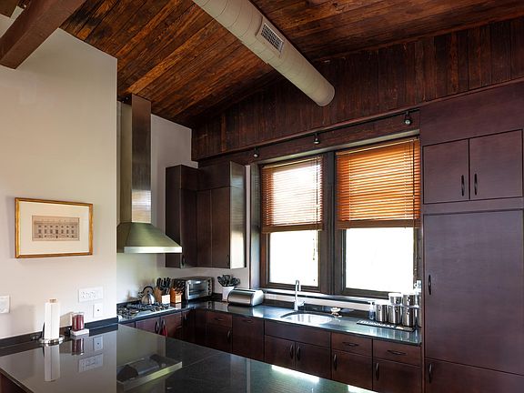 Kitchen with granite counter tops and stainless steel appliances