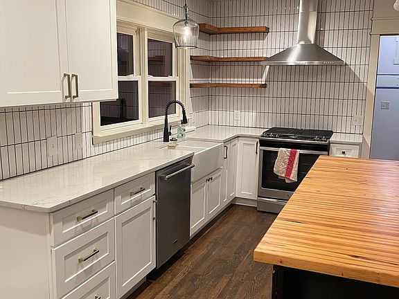 Renovated kitchen with quartz and butcher block counters