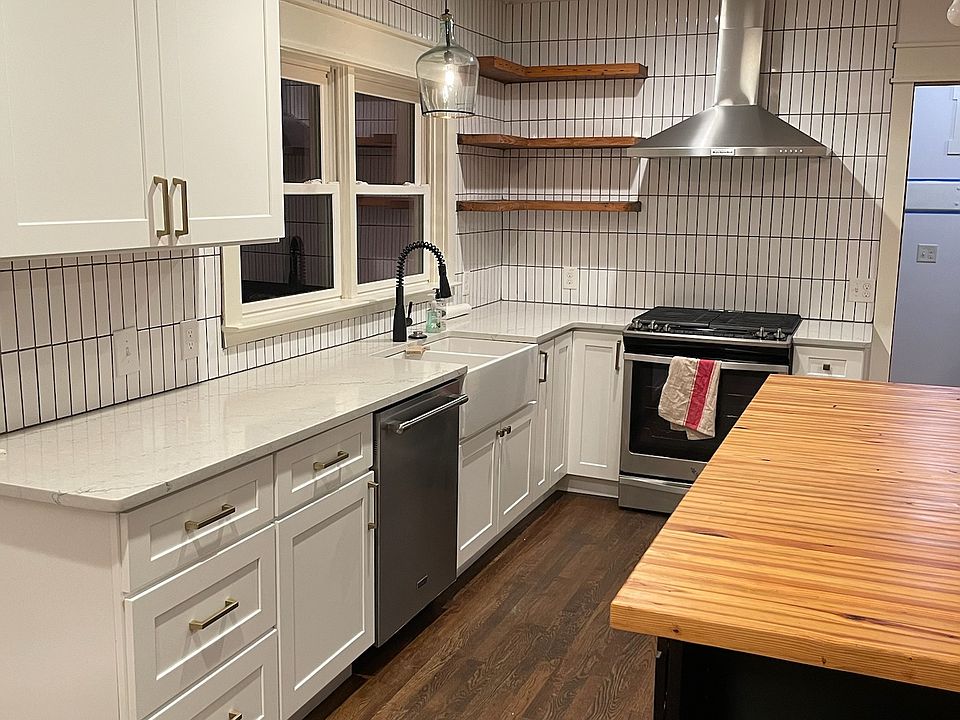 Renovated kitchen with quartz and butcher block counters