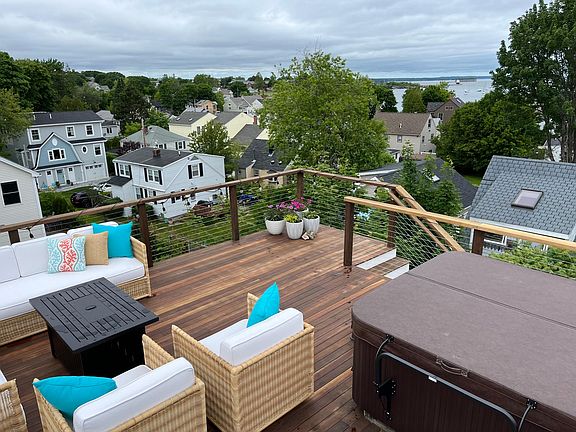 Rooftop deck with Therapeutic massage hot tub and Ocean views features all new Serena and Lily furniture.