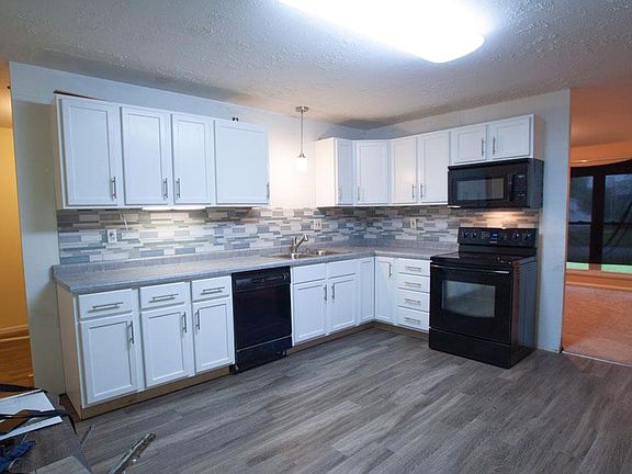 Kitchen opens to laundry room and family room