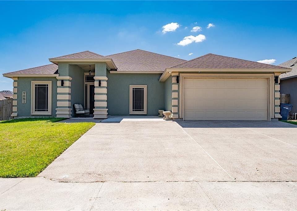Front view of the house. Two car garage. Driveway has an extra room to park your boat, or extra car.