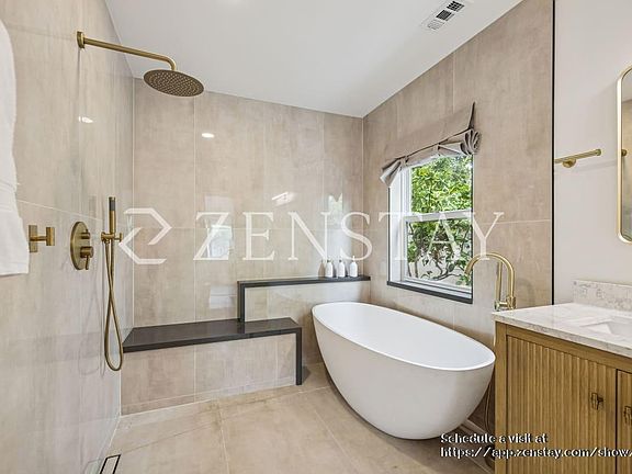 Fully renovated master bathroom with open shower and soaker tub!