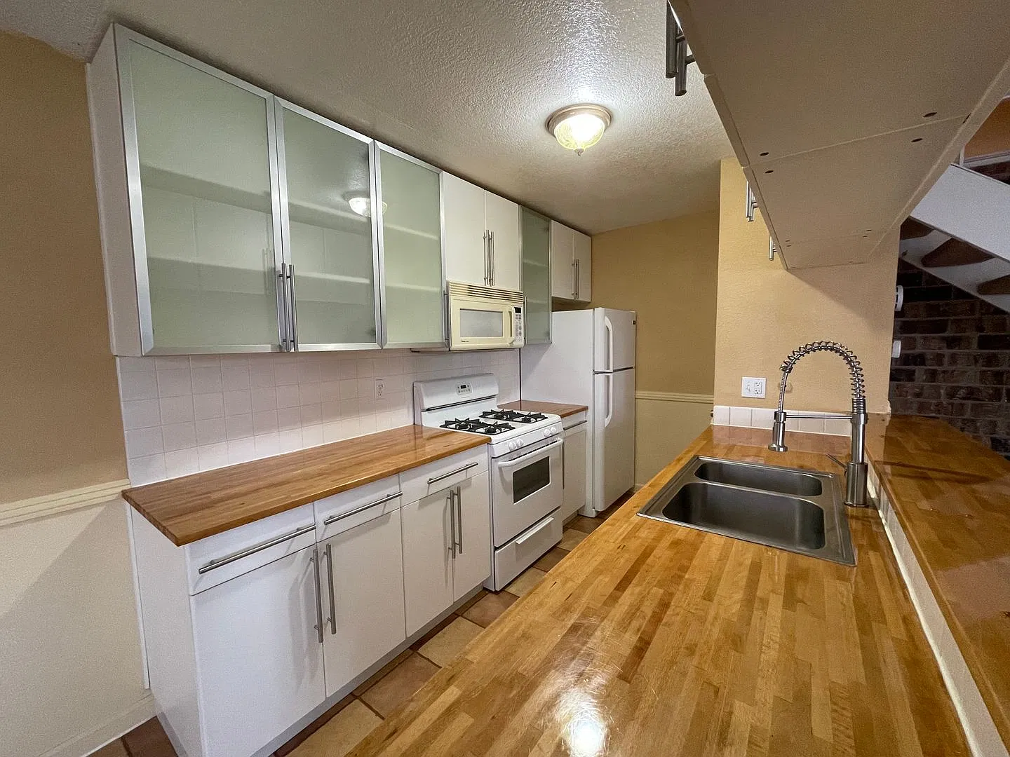 Nicely Updated Two Story Fourplex Unit in Auburn- On site Laundry — Photo 1