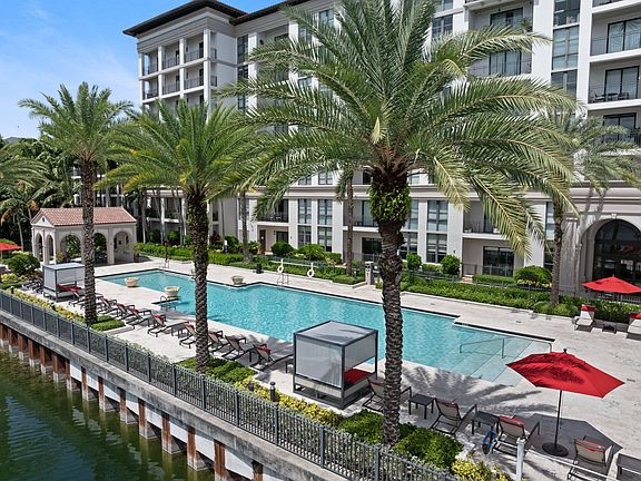 Escape to a waterfront oasis framed by swaying palms and resort-inspired amenities