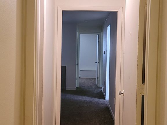 Mud room to living room, office is on the left in photo. Bedrooms and bathroom are straight back through the living room, and kitchen is to the right of the living room.