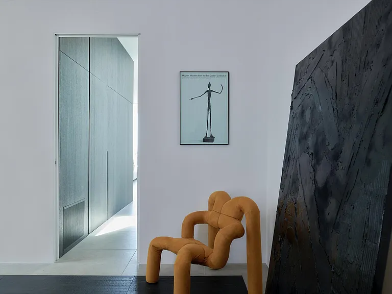 Refined Architectural Detailing with Seamless Transitions _ This space highlights precision craftsmanship with clean lines, recessed doorways, and a smooth integration of materials.