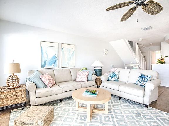 Large living area with comfortable seating with each side table storage accessible.