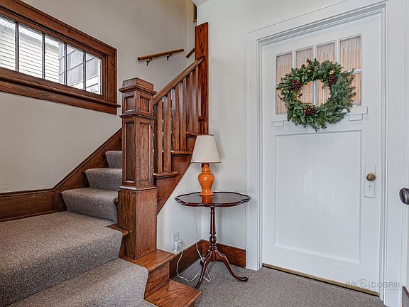 Love the details in the entry foyer. Look at the newell post and window!
