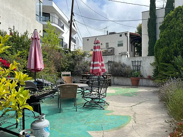 Fully enclosed outdoor patio includes furniture and umbrellas. Great for relaxing outdoors, working or entertaining. Shared with only one other unit.