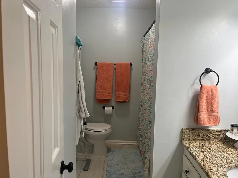 Upstairs bath, includes shower and tub.