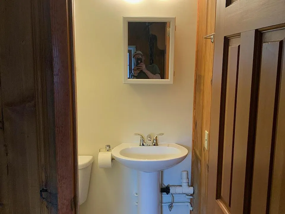 Bathroom has shower stall.
