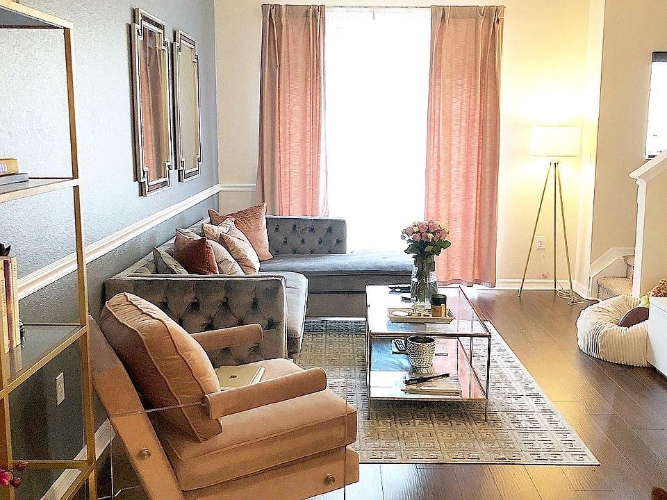living room with doors that lead to the balcony