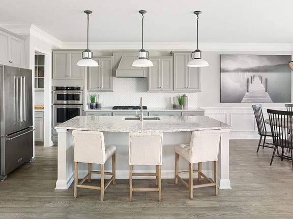 Beautiful Kitchen with over-sized kitchen island, grey cabinets and Stainless Steel Appliances. - Mo