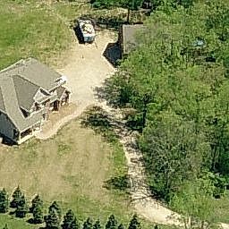 View of home showing driveway approach, SW view of house and pole barn