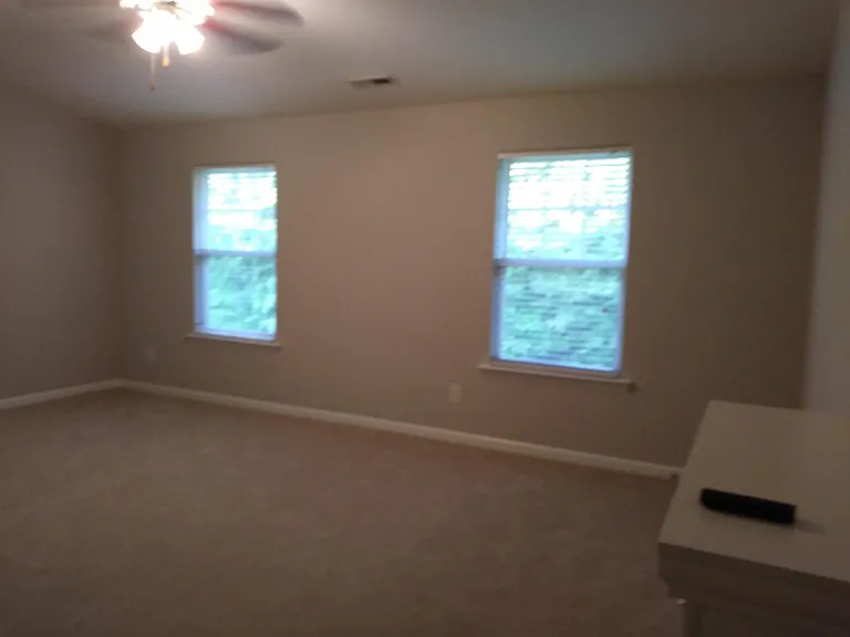 Master accommodates a King sized set and a sitting area next to fireplace.