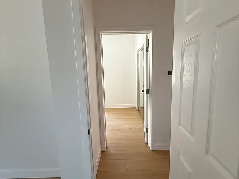 Looking from primary bedroom to 2nd bedroom