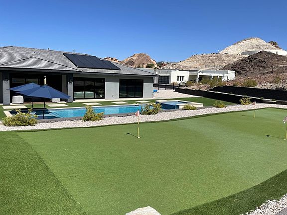 Fully fenced backyard on an 1.5 acre property