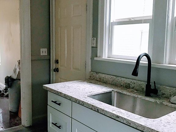 new kitchen cabinets, sink and fixtures
