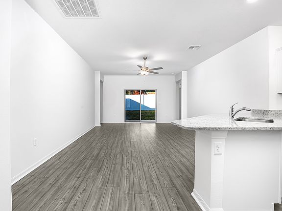 A sliding door in the family room provides a beautiful view of the backyard