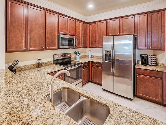 This kitchen is fully equipped with everything you would need: High end cabinets, SS appliances and granite counters, pots, pans and place settings and lots of extras.