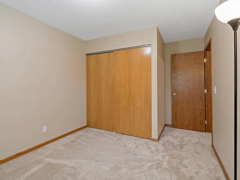 Bedroom #2 with large closet, new carpet, and fresh paint