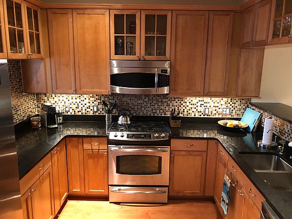 Kitchen with granite countertops and gas range