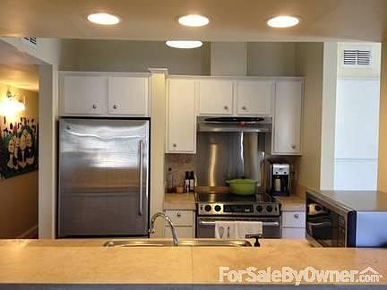 Living Room
						:
						High vaulted ceilings and updated fireplace w/ Travertine detail