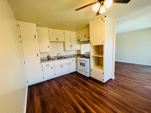 Half Open Kitchen with area for table, new stove / oven.