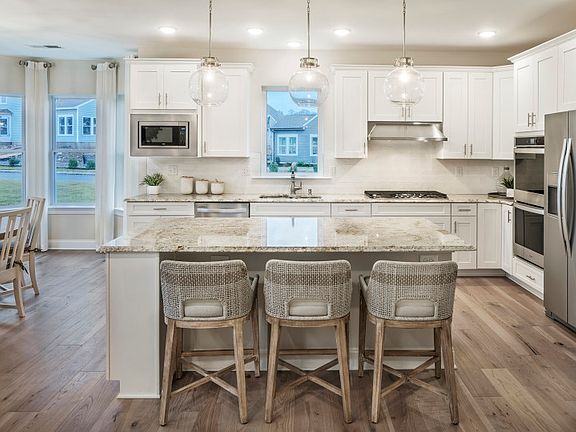 Large center island and stainless steel appliances throughout
