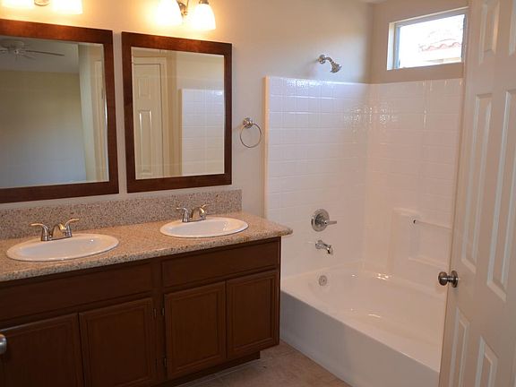 Master Bathroom with Dual Sinks and Big Bathtub