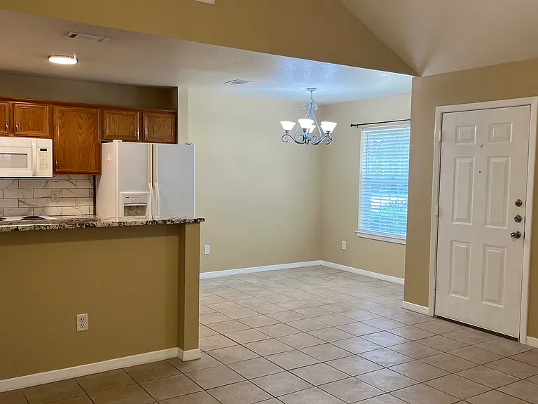 open floor plan with living room, breakfast area, and kitchen