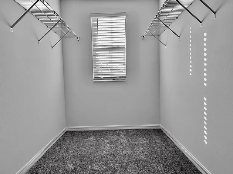 Huge walk-in closet in master bedroom