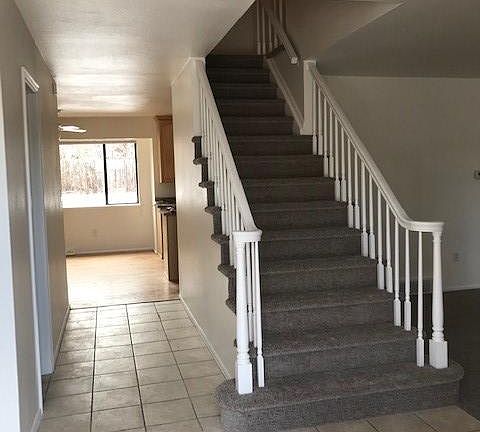 Entry. Kitchen strait ahead, stairs to upper level 4 bedrooms, Living Room on the right.