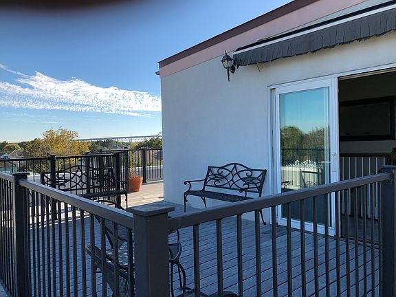 private deck with role out sunshade awning