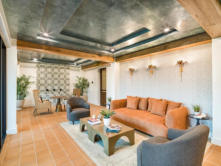 Relax or gather with neighbors in Modera Trailhead's inviting lounge, designed with warm textures and stylish details.