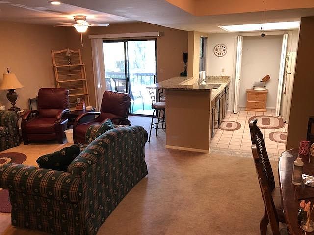 Open front room with updated kitchen with stool seating.