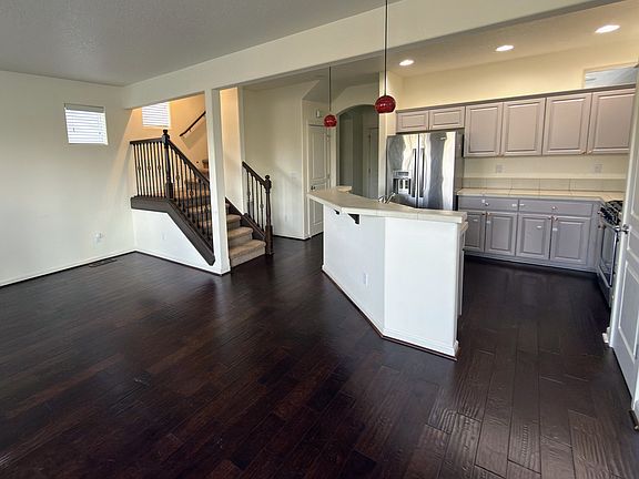 Open main level with hardwood floors and easy sightlines throughout.